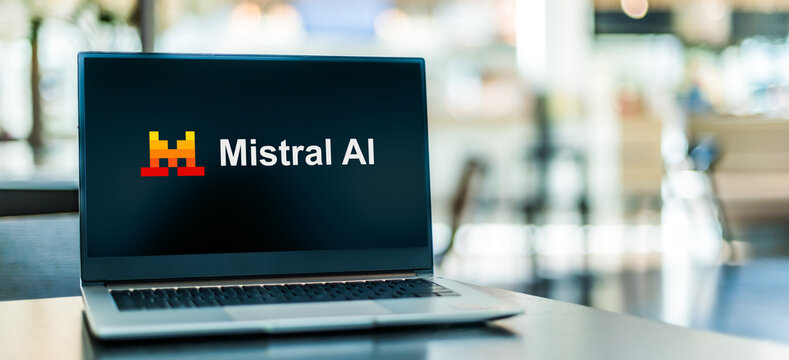 Laptop computer displaying logo of Mistral AI company