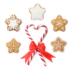 Christmas candy canes and gingerbread cookies isolated on white, set