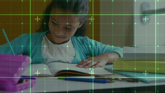 Child reading workbook grabbing pencil from pink case and solving assignment in classroom