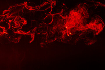 Abstract Movement of Red Smoke Wave on Black Background