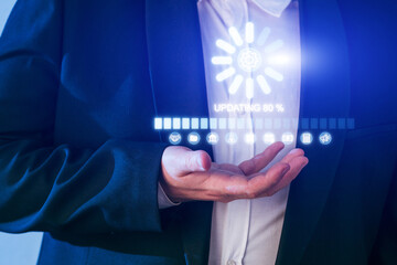 Business professional engaging with a digital interface showing update progress and icons in an office setting