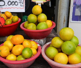 Korean tangerines or Gyul sold in Jeju Island. Translation: One basket for five thousand Korean won.