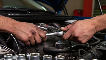 auto mechanic changing car engine