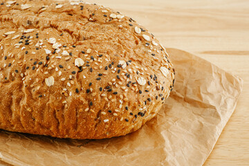 Whole Grain Bread Freshly baked bread topped with flax seeds and sunflower seeds