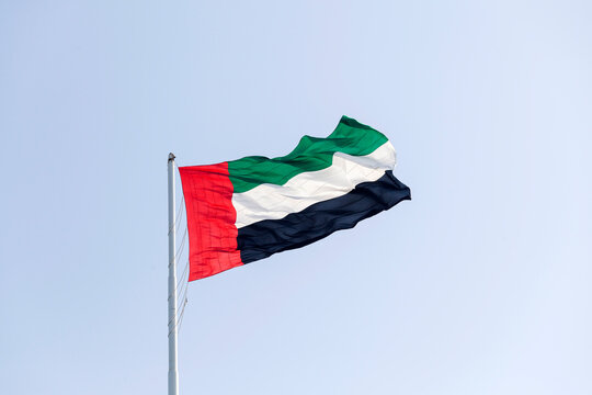 UAE flag in Abu Dhabi waving outdoor. UAE National day. UAE flag day.