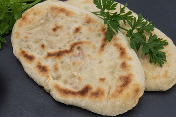Homemade flatbread with herbs and tomato sauce