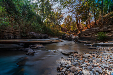  rafting spot on the Mae Wang River in Chiang Mai Province. The river flows, surrounded by rocks and mountains, captured beautifully with  wide-angle lens. tourist attraction in Chiang Mai, Thailand.