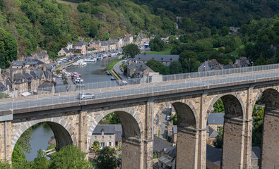 Panoramic view of the city and the viaduct bridge over the Rance River on a sunny summer day, Dinan, Cotes-d'Armor, Brittany, France