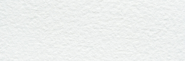 Close-up of white textured surface with subtle patterns and soft lighting.