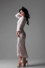 Fototapeta premium Elegant modern bridal fashion featuring a stylish bride in a minimalist white dress