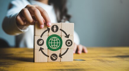 Sustainable cycle of Environmental Stewardship: A child's gentle hand presents a wooden block adorned with an emblem representing the earth's natural cyclical sustainability.