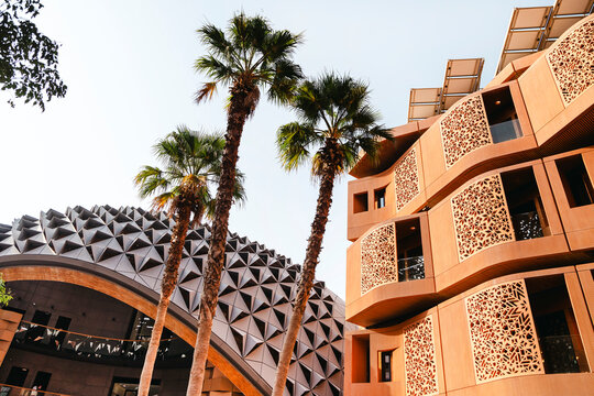 The Masdar Institute of Science and Technology exterior with green garden on the foreground. Sustainable environment.