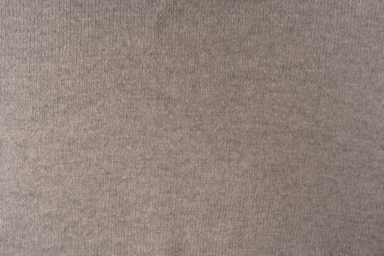 Soft grey merino wool sweater texture as a background.