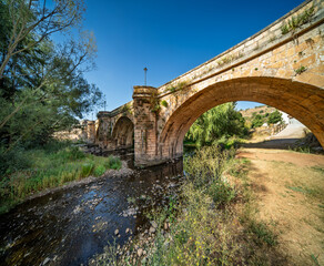 Medieval bridge over Arlanza river in Covarrubias, Spain