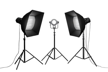 Professional studio lighting setup with softboxes and a spotlight on tripods against a black backdrop on transparent background