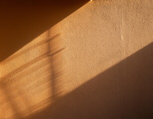 golden hour sunlight painting a geometric shadow on a textured wall casting warmth and highlighting
