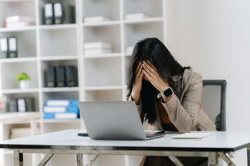 Business Dilemma: A woman in a professional environment, grappling with stress as she places her...