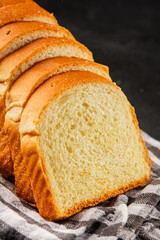 Brioche bread slices bakery pastry natural product tasty snack fresh delicious gourmet food background on the table rustic top view copy space