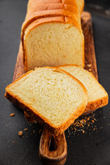 Brioche bread slices bakery pastry natural product tasty snack fresh delicious gourmet food background on the table rustic top view copy space