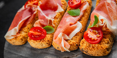 jamon bruschetta prosciutto appetizer portioned tapas dish natural tasty snack fresh delicious gourmet food background on the table rustic top view copy space