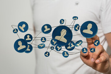 Hand touching social network connections. Abstract image showing connections, networking and communication, with a business theme