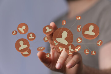 Hand connecting people via digital interface, representing social network and connections. Teamwork, group, and social relations concept, with 1