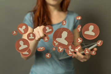 A woman interacts with digital network, representing social media, business connections and online communities with user avatars.