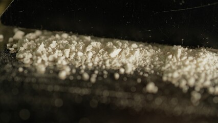 Drugs cocaine or oxy substances abuse and addiction. Hard illegal drugs. Preparing strips of white powder to blow. Drugs trafficking. Opioid crisis and opiates epidemic. Painkillers medications abuse.