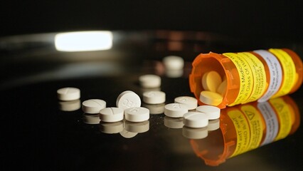 Medications pills and drugs spilled out of container. Pharmaceutical Industry. Modern drug and...