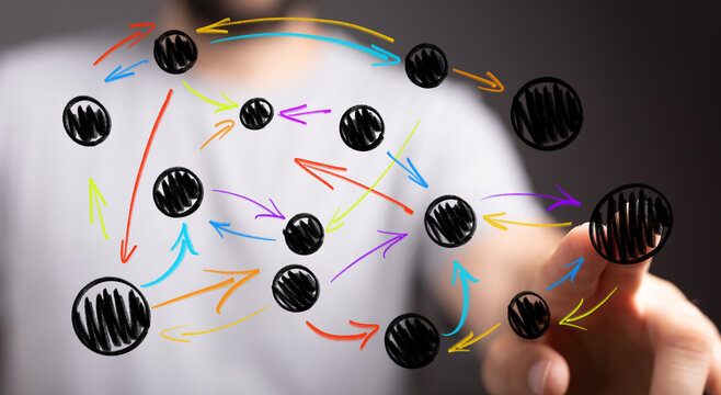 A human hand interacts with a digital network, showing interconnected nodes and colorful arrows representing data flow, strategy, or complex bus