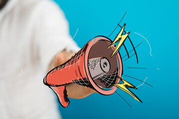 Fototapeta premium Marketing concept, announcement, hand holding megaphone, communication, loud message, news, digital marketing, promotion, advertising.