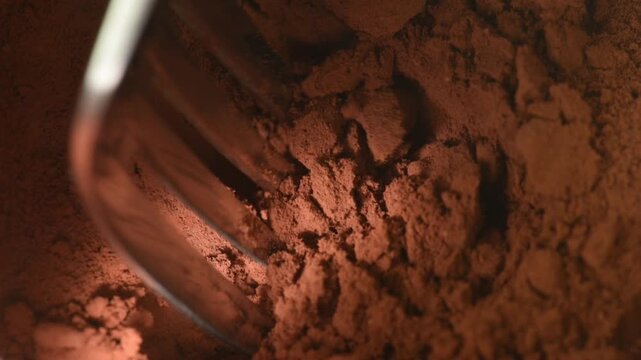 cocoa powder close-up, move with a fork.