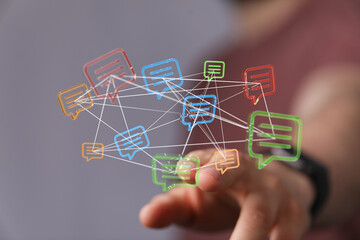 Hand touching digital chat bubbles network concept, representing online messaging, connections, and communication. Symbolizing global access to