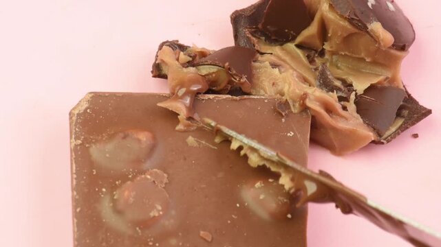 chocolate candies with caramel cut and crushed, close-up,