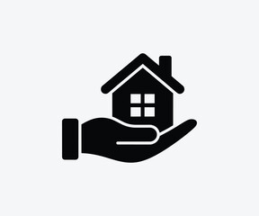 Fototapeta premium Hand holding house icon representing home ownership and real estate