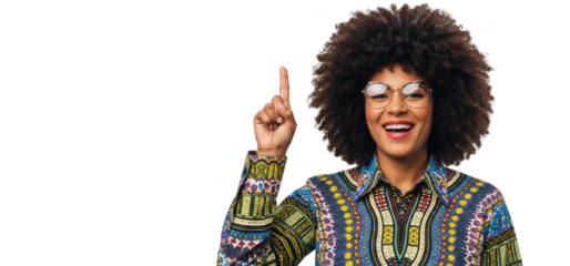 A smiling woman with an afro wearing glasses and an ornate shirt, giving a peace sign, against transparent background