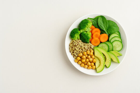 Colorful vegan salad bowl with avocado, quinoa, broccoli, spinach, cucumber and carrot on beige background. Healthy food concept. - Powered by Adobe
