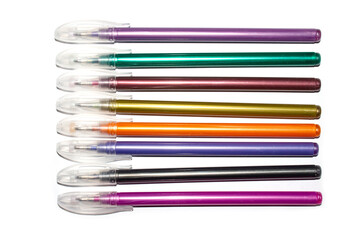A set of colorful gel pens on a white background.Gel pens with mother-of-pearl.Gel pens for signing postcards.Gel pens background.