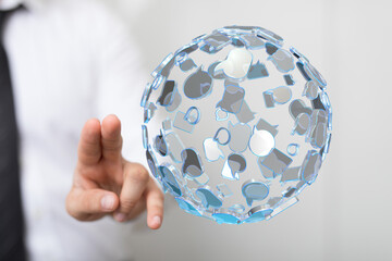 A businessman points to a sphere made of social media icons, symbolizing digital connection, communication, and global networking. Perfect for t