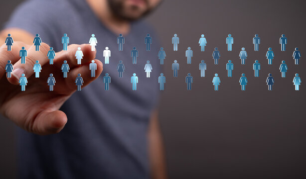 An image of a hand interacting with digital people icons, representing concepts of community, connection, and social networking.