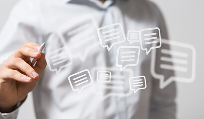 Close up of a man hand drawing message bubbles concept for communication. Online chat and messaging social media concept. Communication, feedbac