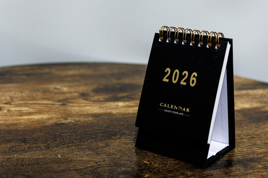 2026 calendar monthly page on wooden table background