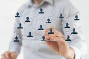 Visual representation of network, teamwork, and social connection with digital interface of human icons.