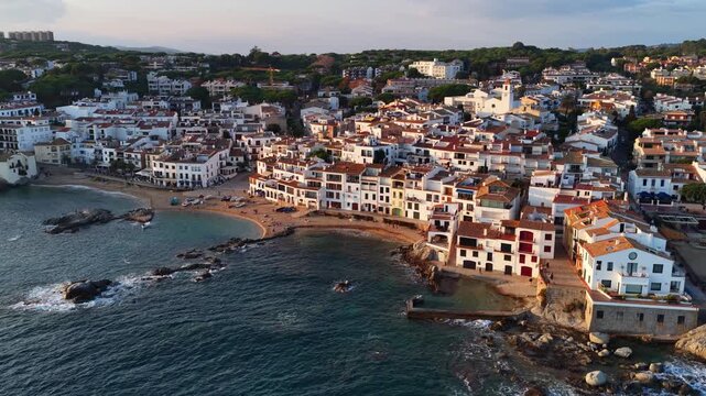 drone view of Calella de Palafrugell resort town on Costa Brava at sunset, Catalunya, Spain, vacations on Costa Brava