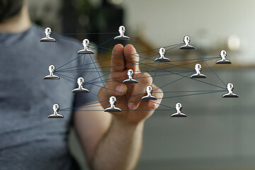 Hand touching connections representing social network, teamwork and communication concept. Networking and global community metaphor