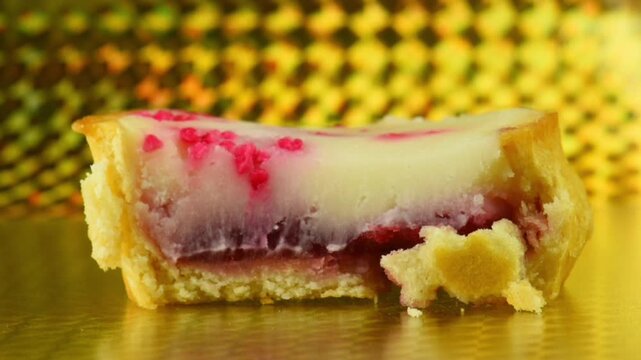 close-up of cutting a cheesecake with a spoon.