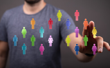 Visualize connections and community. A person interacting with digital icons. This image captures teamwork and diversity, representing unity and