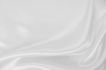 Smooth elegant white silk or satin luxury cloth texture as wedding background. Luxurious background design