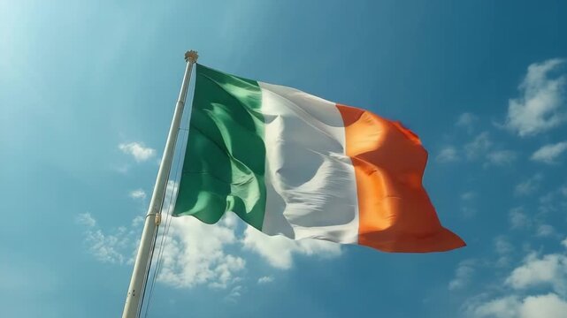 Irish flag waving under clear blue sky