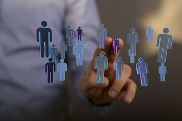 Abstract concept of digital network connecting people, hand touching futuristic icons, representing teamwork, communication, and collaboration.